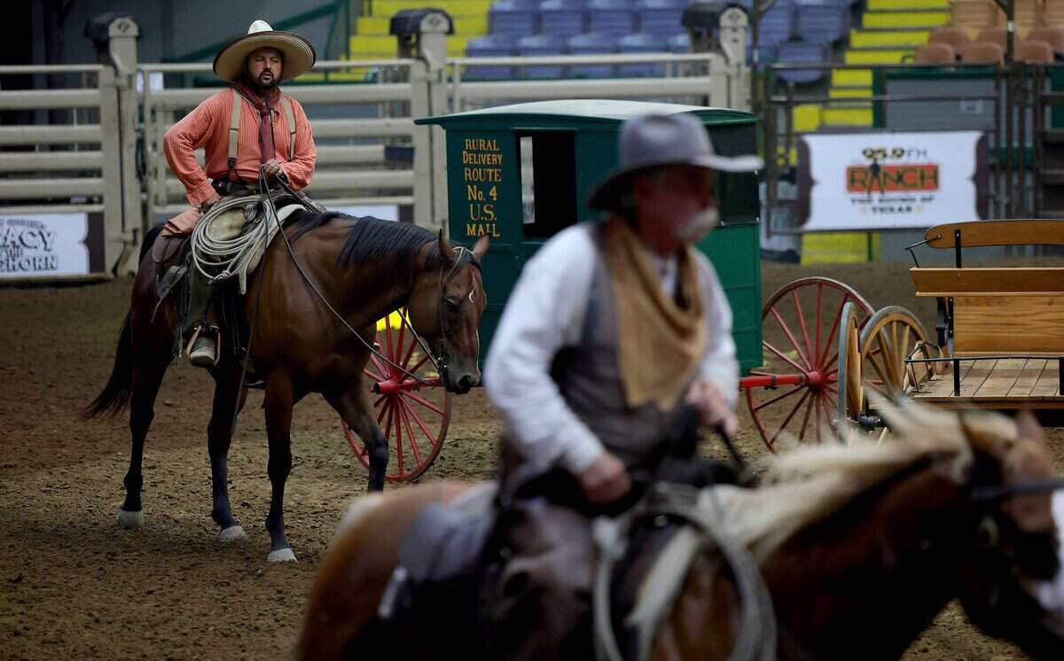 Fort Worth Herd drovers warm up before driving the herd into the Cowtown Coliseum for a show on Tuesday, Aug. 25, 2026.